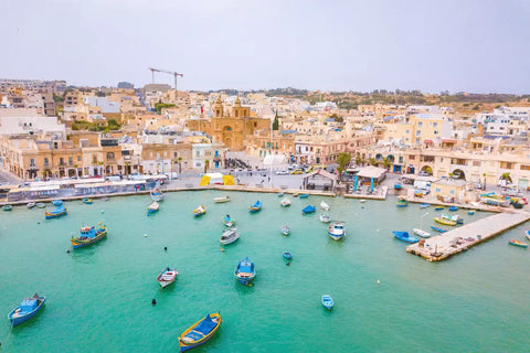 Malta – A dynamic cityscape showcasing a bustling urban skyline, vibrant streets, and iconic landmarks that capture the essence of modern city life.
